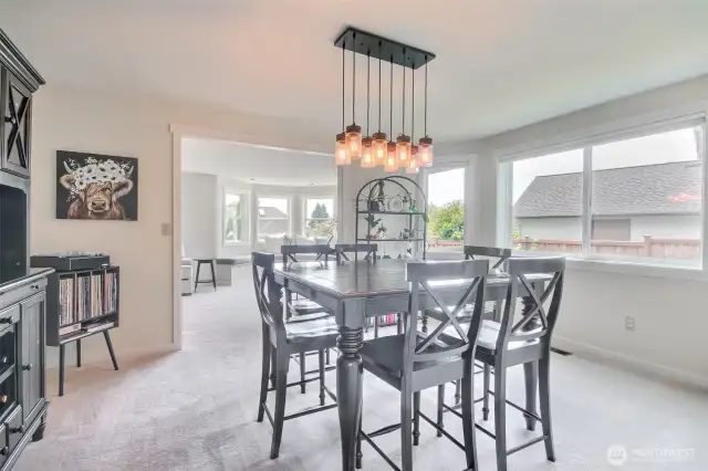 This spacious dining room features an open-concept layout.