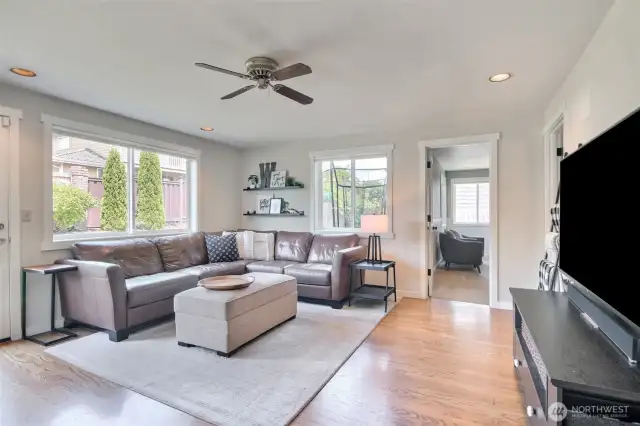 family room with recessed lighting and ceiling fan.