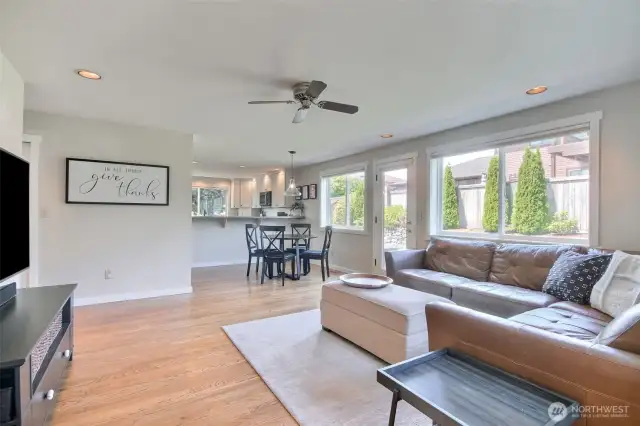The open-concept layout flows effortlessly into the adjacent living area, perfect for entertaining or keeping an eye on the action while preparing meals.