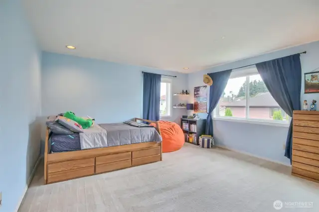 Large upstairs bedroom with walk in custom closet.