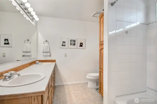 Full size bathroom upstairs with dual sinks and tons of storage space.