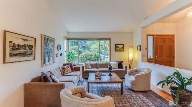 The spacious living room can accommodate may friends and guests.  The home has mostly hardwood floors with 2 bedrooms with carpet.