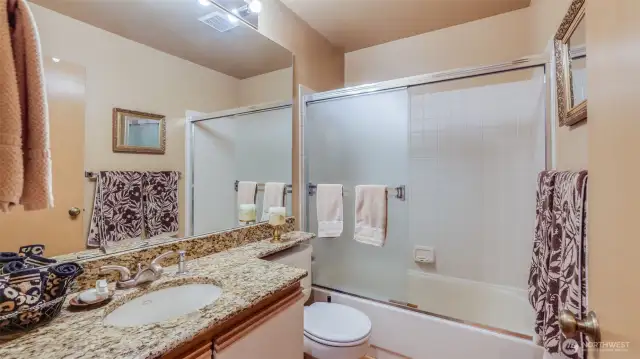 The full hall bath has been updated in an elegant manor.