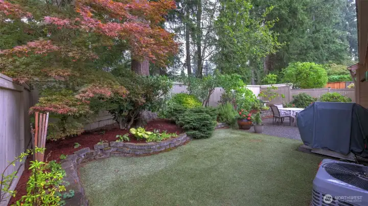 The backyard grass is synthetic and a great way to keep the backyard green all year around.