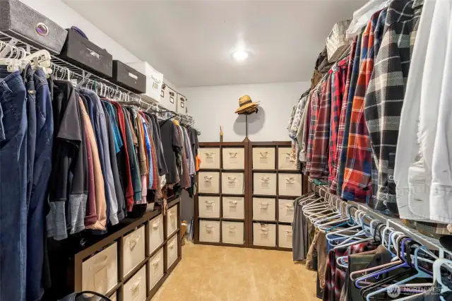 Into the massive primary closet with attic access.
