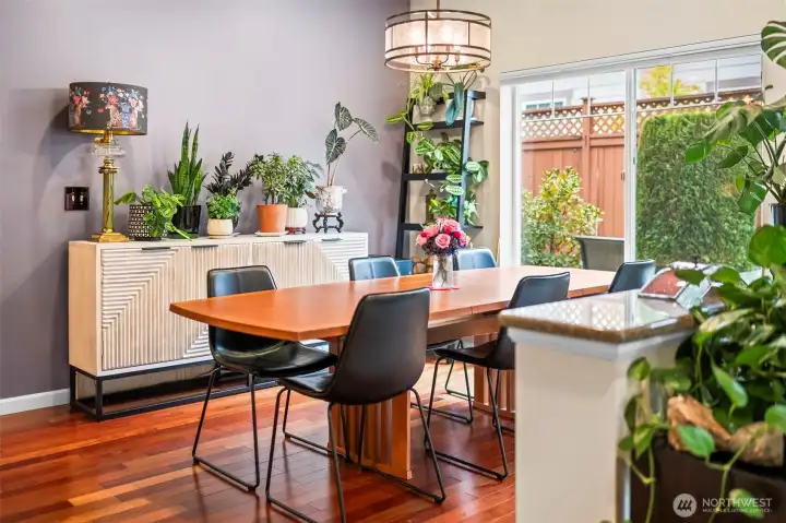 Ample seating in the dining room that is filled with light. New paint exists throughout the full interior of the home.