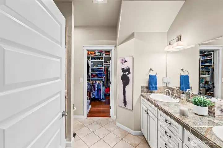 Primary en suite has a fully tiled walk-in shower and walk-in california closet.