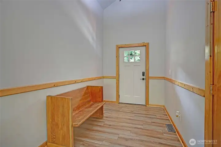 Spacious entry w/welcoming interior...