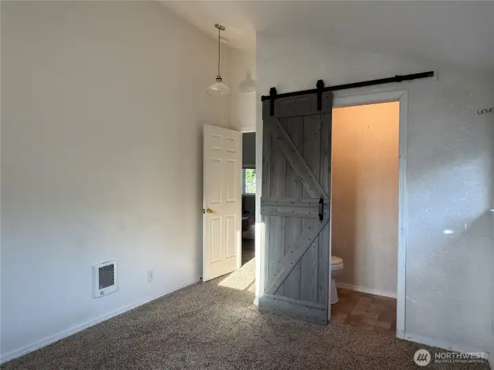 Bedroom one with half bath