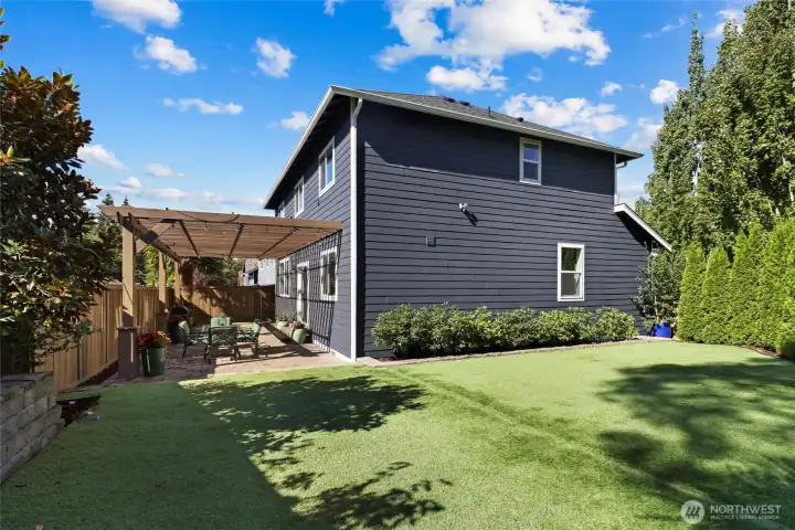 Designer landscaping & huge fenced yard.