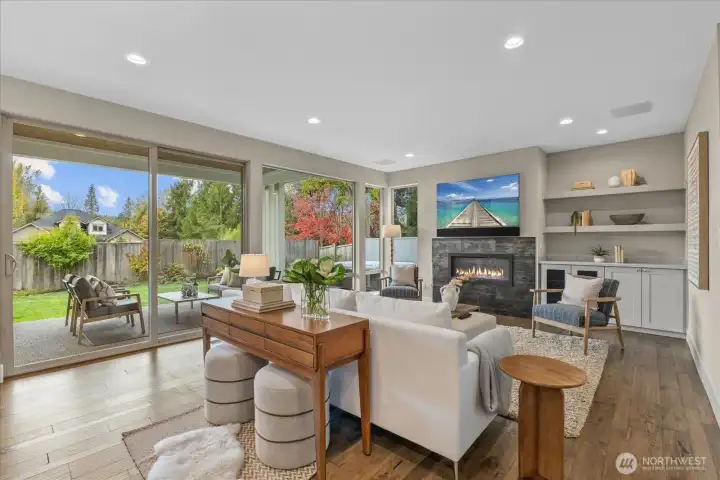 WRAPPED IN SLIDING GLASS DOORS TO COVERED OUTDOOR LIVING AREA