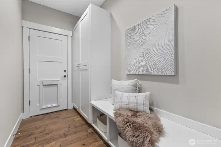 ENTRANCE FROM THE GARAGE W/PLENTY OF BUILT-IN STORAGE