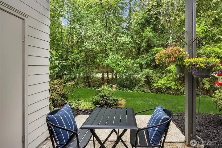 Adorable patio overlooking the HOA maintained green space. Room for pots and hanging baskets to complete the European al fresco look.