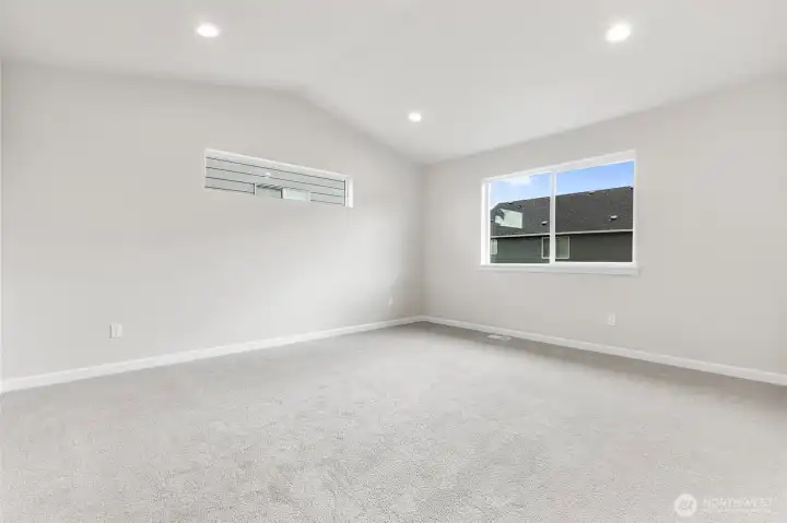 Primary Bedroom with Vaulted Ceilings. Home Under Construction - Photos are not of actual home. Colors and finishes may vary. Photos may contain upgrades