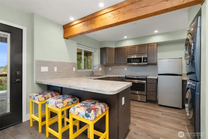 Full kitchen with stove.