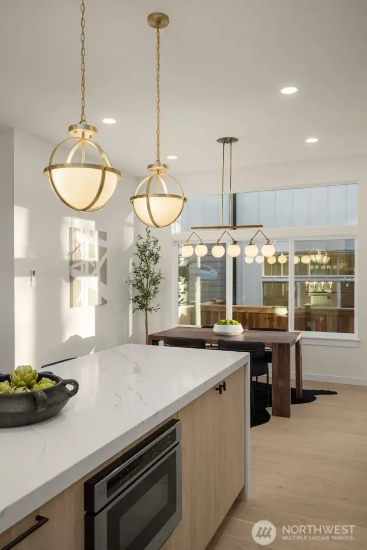 Gorgeous gold pendant lighting in the kitchen.