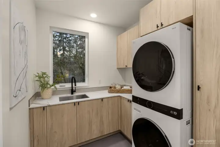 Convenient upper level laundry room.