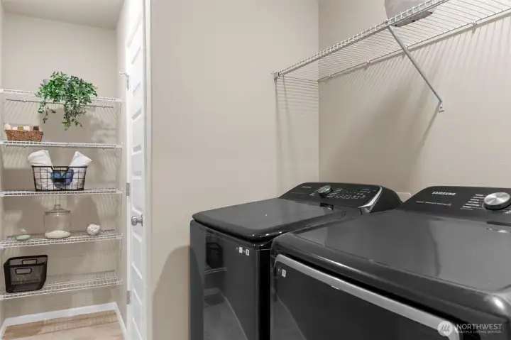 Laundry room with plenty of storage.