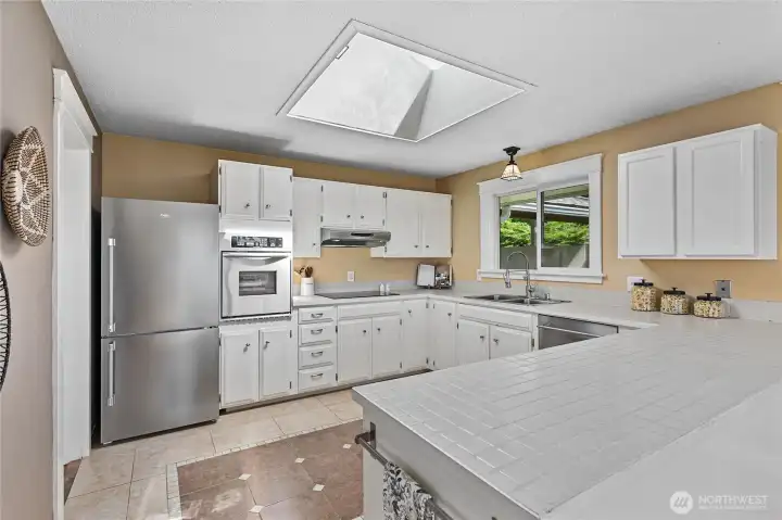 Windows and skylight throughout bring in natural light