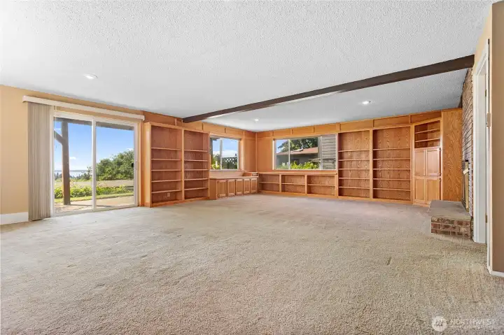 Lower floor with built in book cases and room for hobbies, project, movie room, exercise, etc