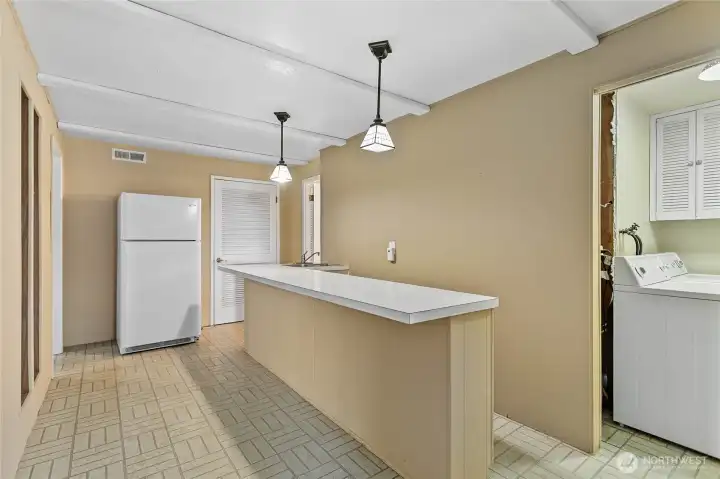 Bar, kitchenette, oh the possibilities! Utility room upstairs and downstairs