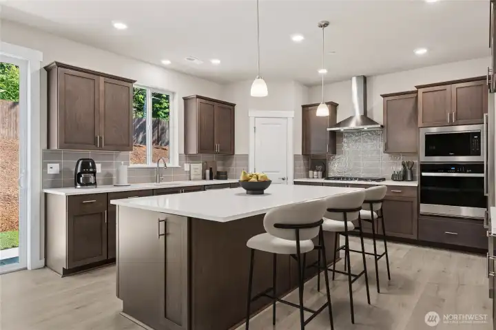 Massive kitchen island for entertaining! Virtually staged. Photos are  for representational purposes only. Some colors and finishes may differ.