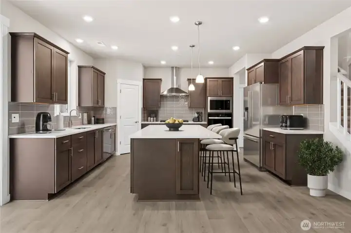 Gourmet kitchen with gas cooking.  Virtually staged. Photos are  for representational purposes only. Some colors and finishes may differ.