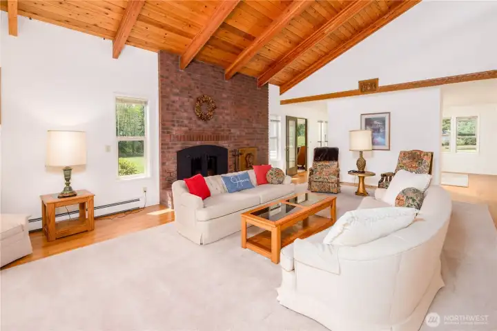 Vaulted ceilings and windows make a brightly-lit and comfy living room Vaulted ceilings and windows make a brightly-lit and comfy living room