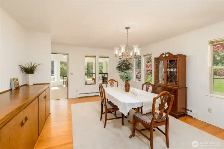 Dining room looking towards the sunroom with lots of natural lighting and convenient built-in buffet Dining room looking towards the sunroom with lots of natural lighting and convenient built-in buffet