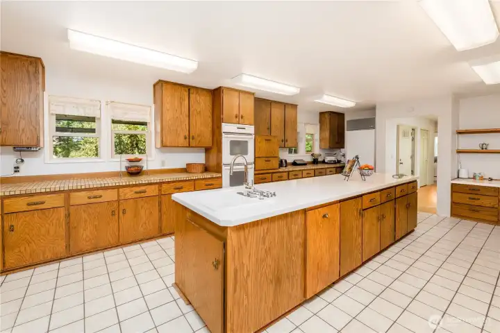 Tons of countertop space, plus an island sink and a built in desk in the upper right of the picture Tons of countertop space, plus an island sink and a built in desk in the upper right of the picture