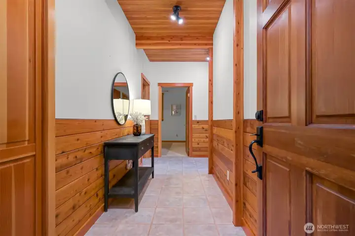 Step inside to a welcoming entry featuring warm cedar finishes, quality craftsmanship, and a spacious layout that sets the tone for the home beyond.