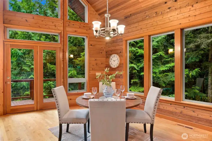 Enjoy meals surrounded by woodland views in the dining area, with easy access to the deck for effortless indoor-outdoor entertaining.