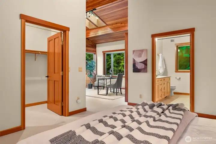 The private primary suite offers a generous walk-in closet, ensuite bath, and convenient access to the adjacent loft, creating a comfortable and functional owner's retreat.