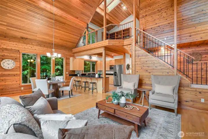 Expansive living spaces, soaring ceilings, and an open loft combine to create a bright, welcoming interior that balances comfort with Northwest lodge-inspired design.