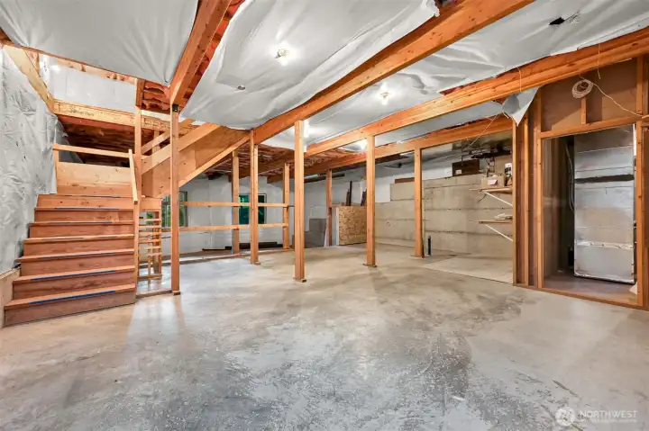 The expansive unfinished lower level offers exceptional flexibility for storage, hobbies, a workshop, home gym, or future expansion to suit your needs.