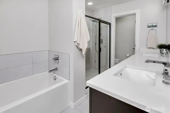 Primary bathroom with dual floating vanity