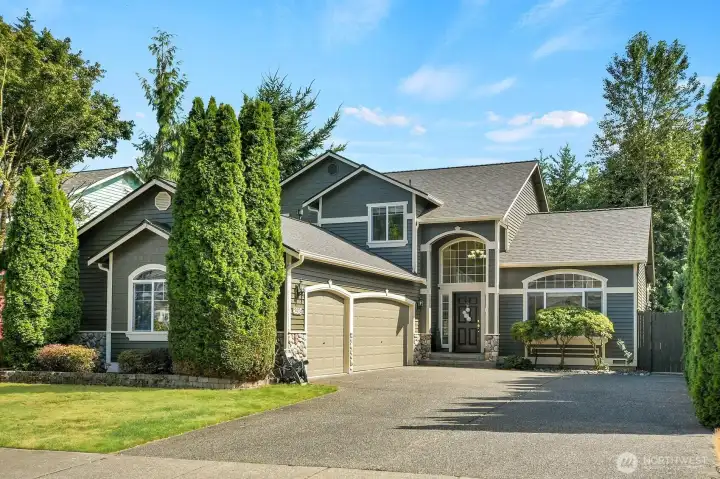 Exceptional curb appeal defines this beautifully maintained home, showcasing timeless architecture, lush landscaping, and a grand covered entry that creates a memorable first impression. Exceptional curb appeal defines this beautifully maintained home, showcasing timeless architecture, lush landscaping, and a grand covered entry that creates a memorable first impression.