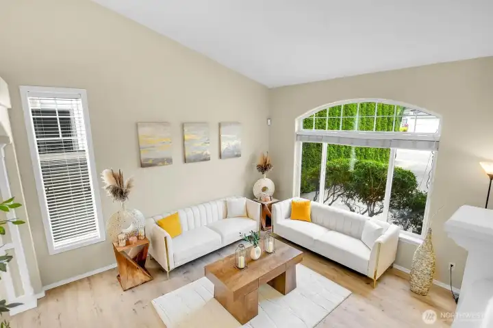 Spacious formal living room highlighted by vaulted ceilings, oversized windows, and an abundance of natural light. Spacious formal living room highlighted by vaulted ceilings, oversized windows, and an abundance of natural light.