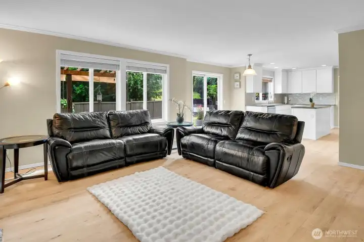 Open concept family room flows seamlessly into the kitchen and dining area, creating the perfect gathering space. Open concept family room flows seamlessly into the kitchen and dining area, creating the perfect gathering space.