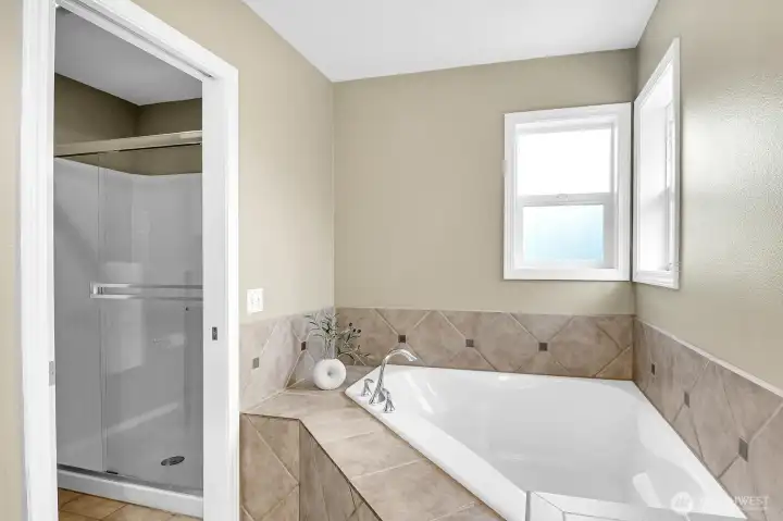 Relax and unwind in the soaking tub with separate walk-in shower. Relax and unwind in the soaking tub with separate walk-in shower.