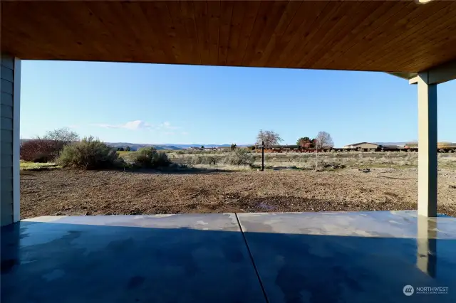 Covered porch with close access to gold course.