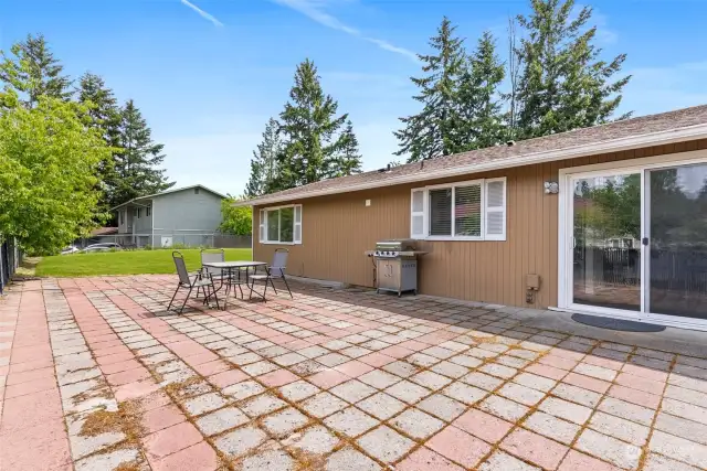 Large paver patio with Room for BBQ, family, & friends.