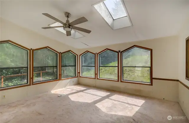 So much to see out the numerous windows to watch the weather change and spectate nature from the wooded area on the property.