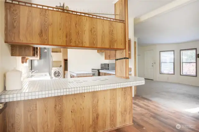 Open concept floor plan shown here from the dining room overlooking the kitchen and living room.