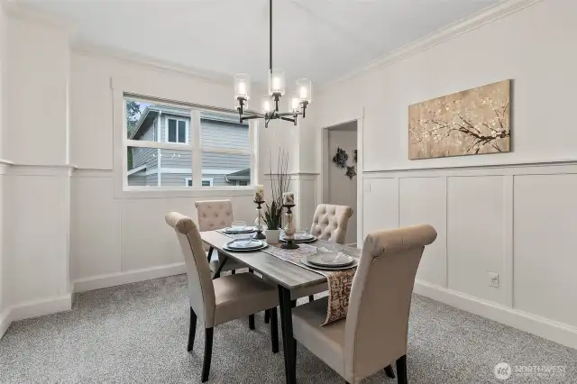 Formal dining room and a doorway into the kitchen.