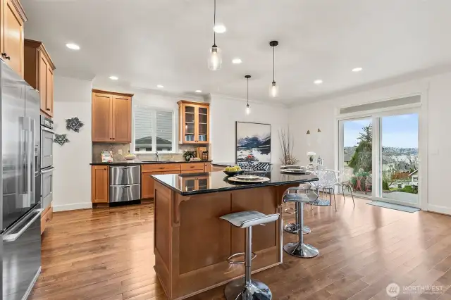 Very spacious kitchen with open floor plan to the dining nook and family room. Out the back slider you have views of Lake Washington and the Olympic Mountains.