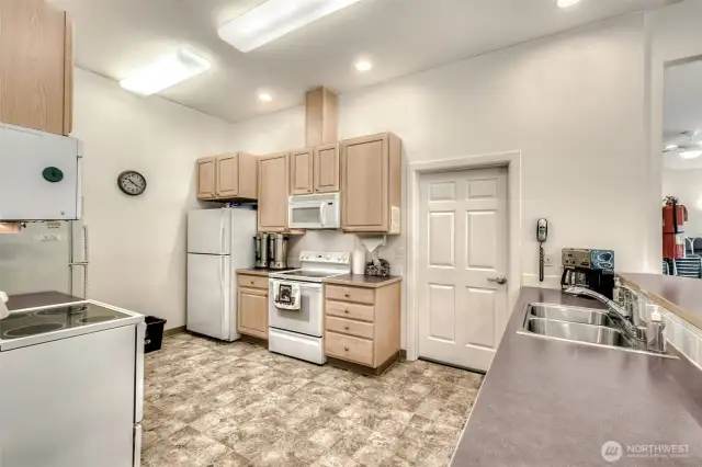 The community center kitchen is designed to be the heart of social gatherings and shared activities.
