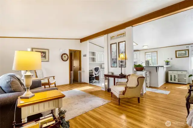 Beautiful vinyl laminate flooring, spacious living room flows into the dining room and kitchen.