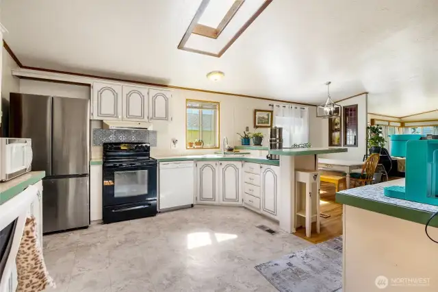 All appliances come with this home (washer/dryer, stove/range, refrigerator, dishwasher).  A coffee bar sits to the right here.