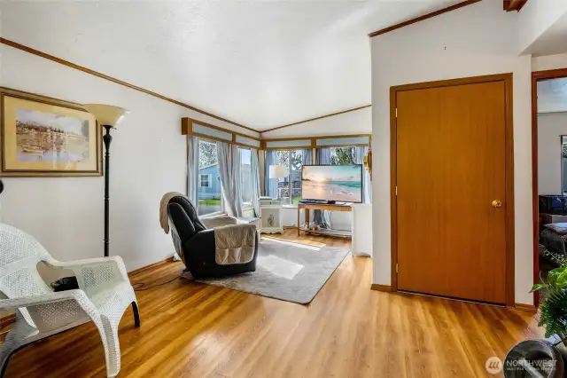 The family room is nice and cozy, and sits at the front of the home, facing the street. Bedrooms are to the right, and the storage closet is quite large.